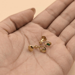 Load image into Gallery viewer, Pear-Cut Synthetic Emerald & Diamond Infinity Swirl Stud Earrings in 18K Yellow Gold