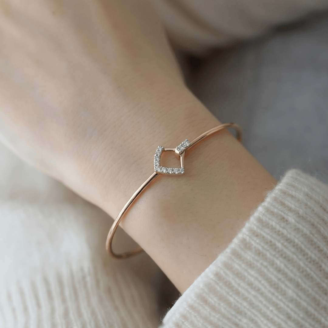 Sleek geometric diamond rhombus hook bangle in 18k yellow gold