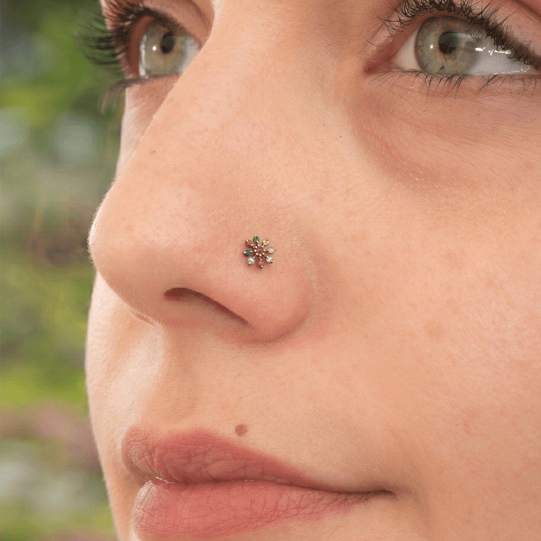 Vibrant navaratna inspired floral nose pin in 18k yellow gold