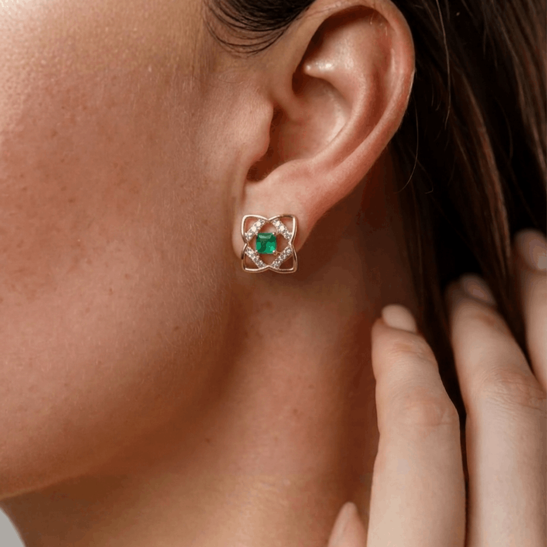 Geometric clover diamond & green gem stud earrings in 18k yellow gold