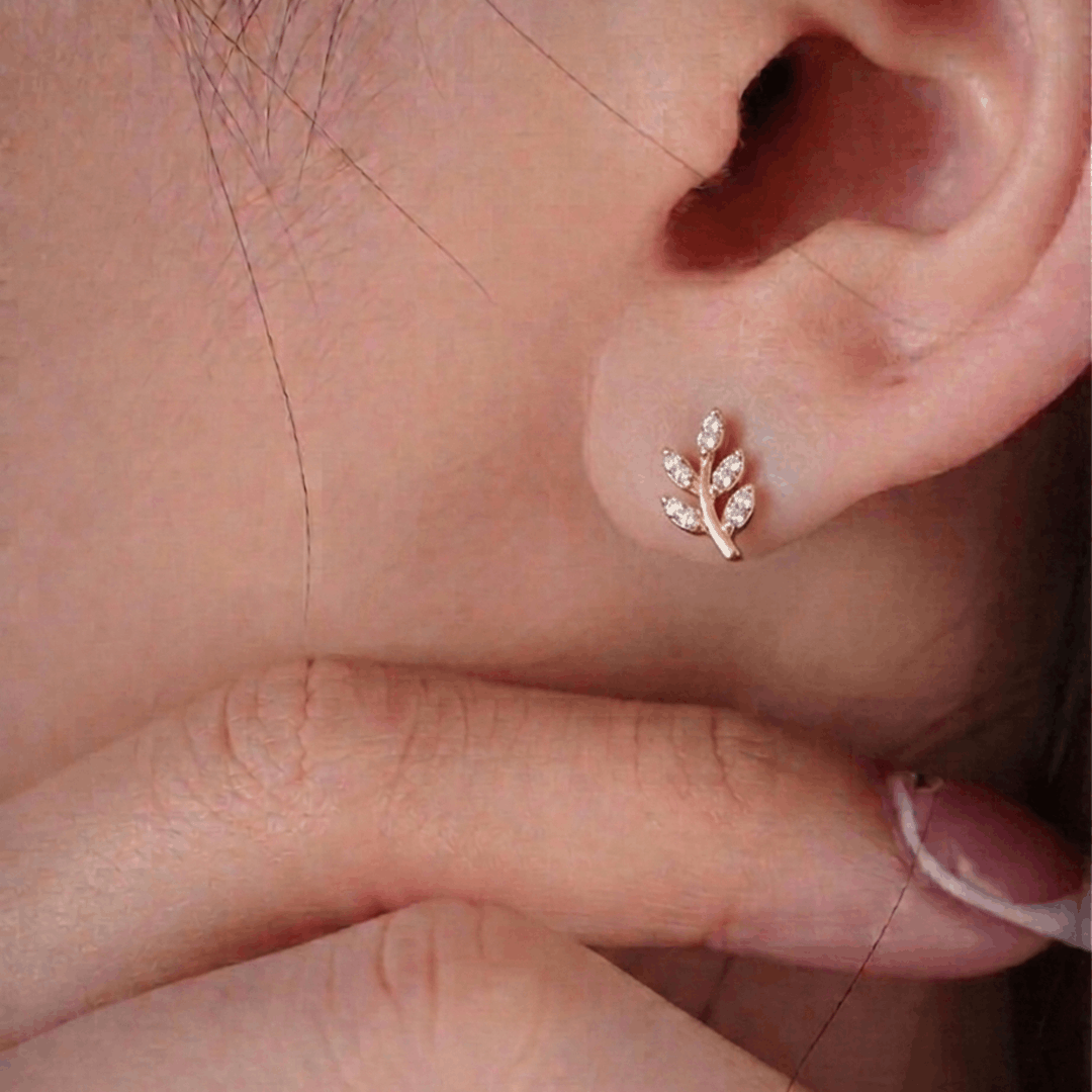 Delicate diamond leaf sprig 18k yellow gold stud earrings