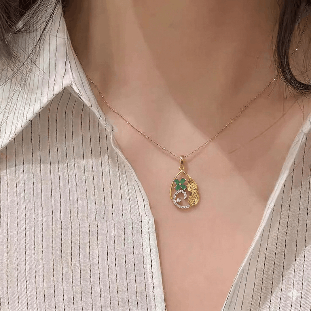 Emerald Bloom & Golden Leaf Pendant in 18K Yellow Gold