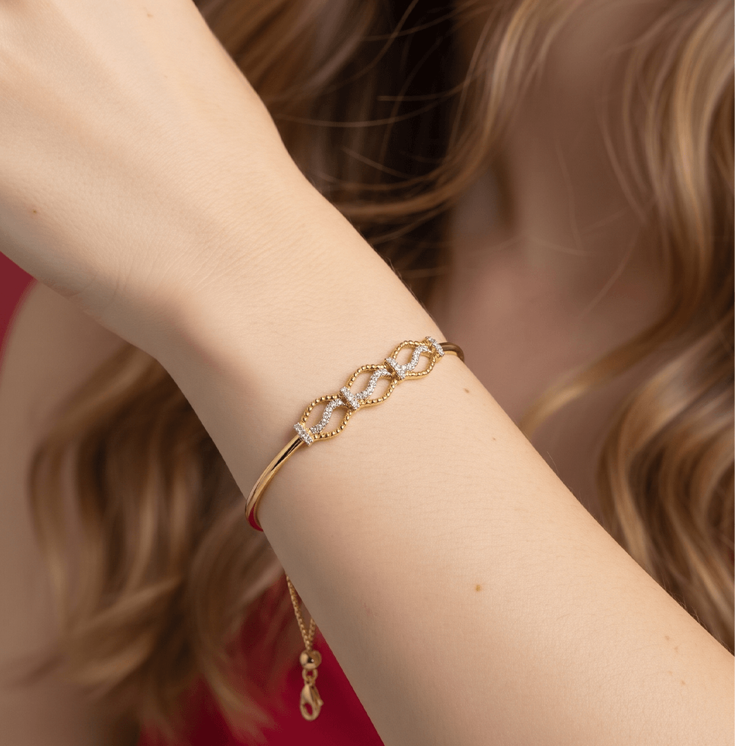 Elegant diamond interlocking wave bolo bracelet in 18k yellow gold