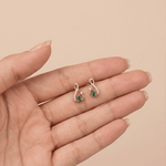 Load image into Gallery viewer, Pear-Cut Synthetic Emerald &amp; Diamond Infinity Swirl Stud Earrings in 18K Yellow Gold
