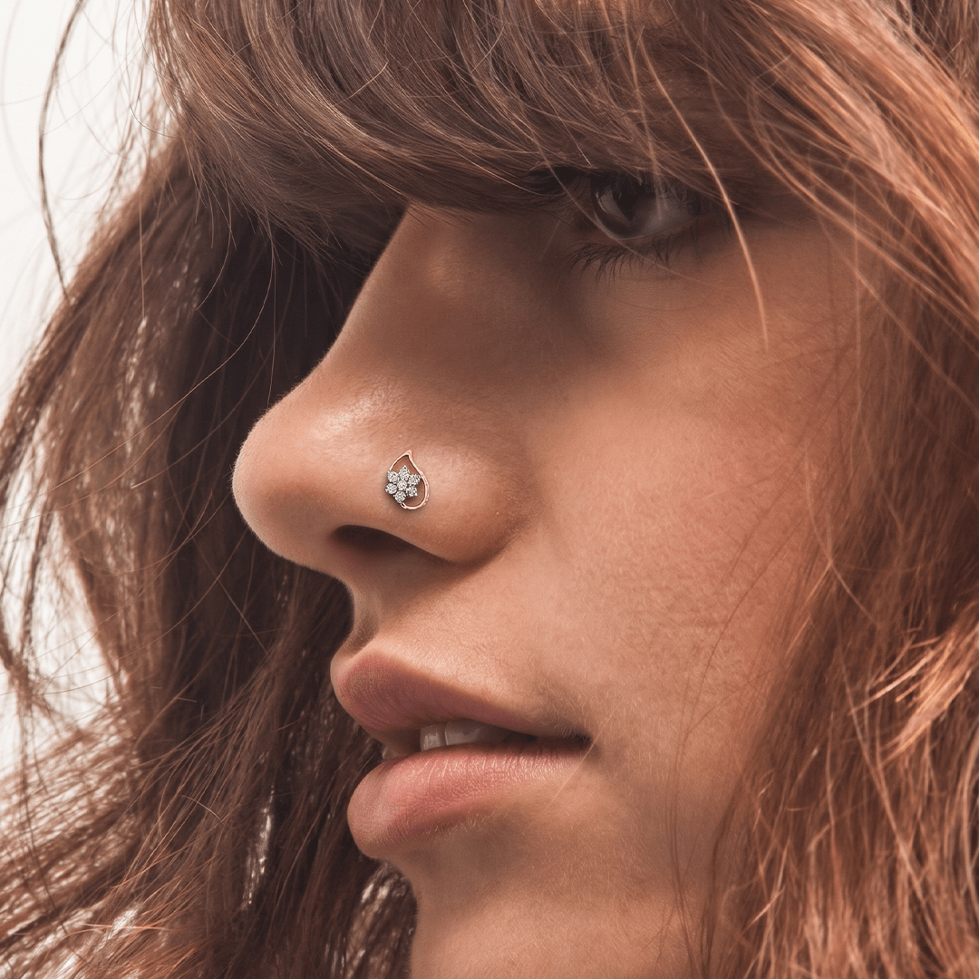 Delicate diamond floral teardrop nose pin in 18k rose gold