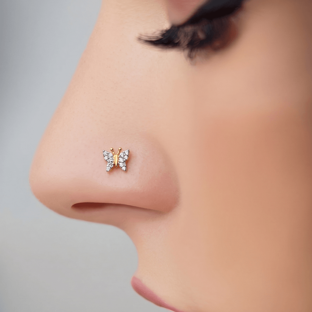 Delicate diamond butterfly nose pin in 18k yellow gold