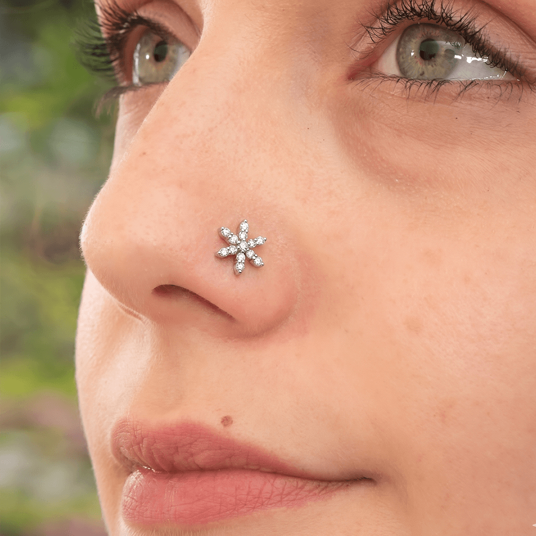 Delicate six petal diamond blossom nose pin in 18k yellow gold
